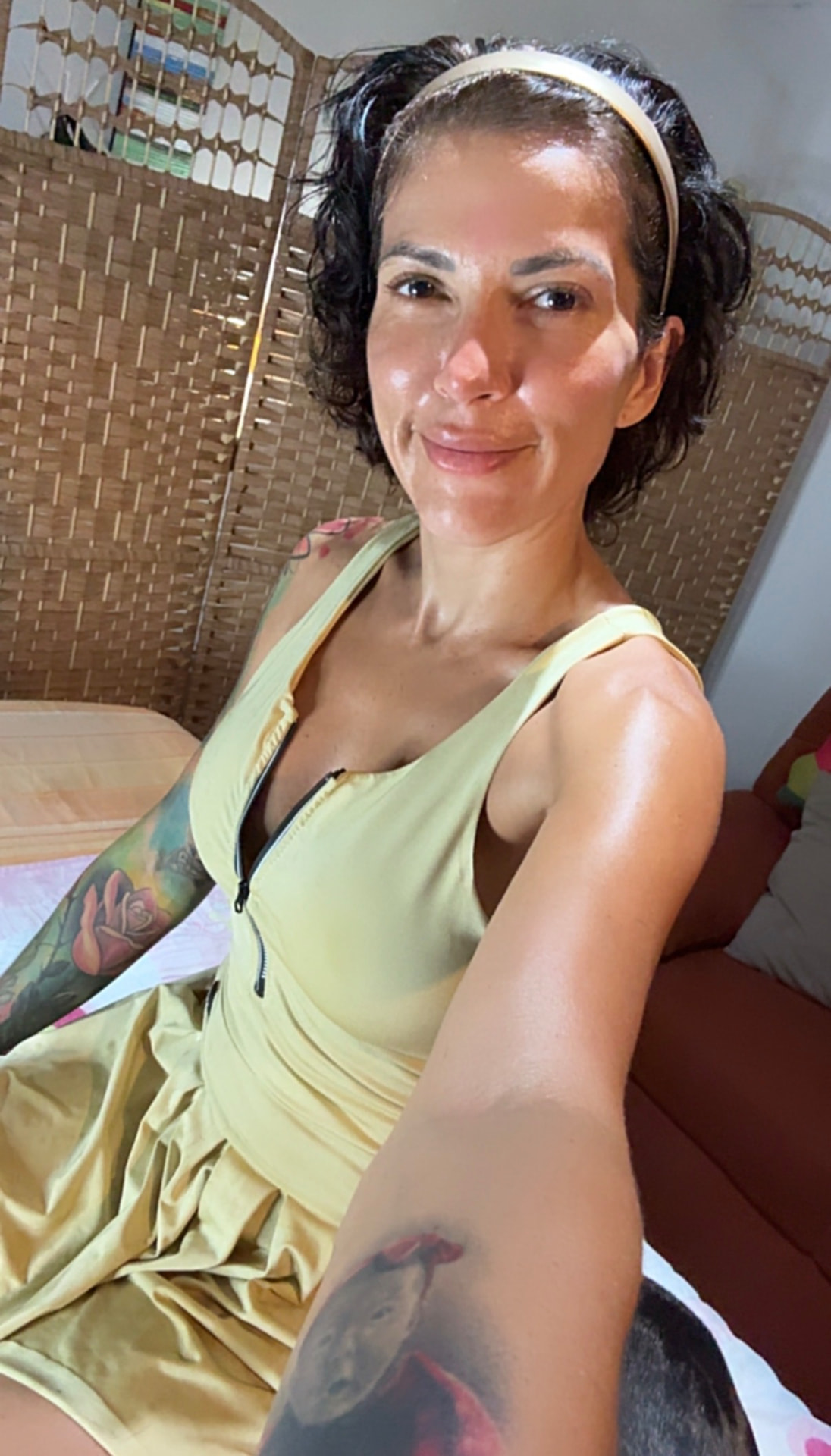 Melissa after a workout in a yellow athletic dress